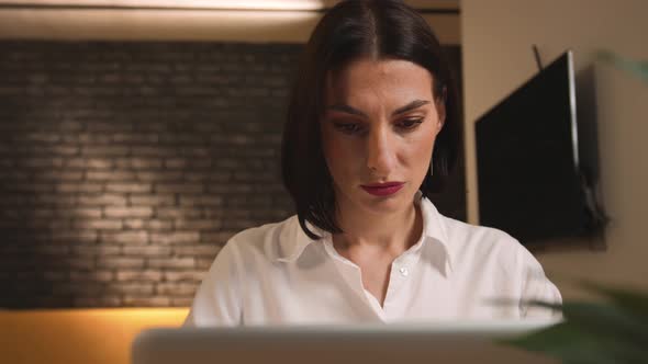 Portrait of Pretty Caucasian Woman Working on Laptop