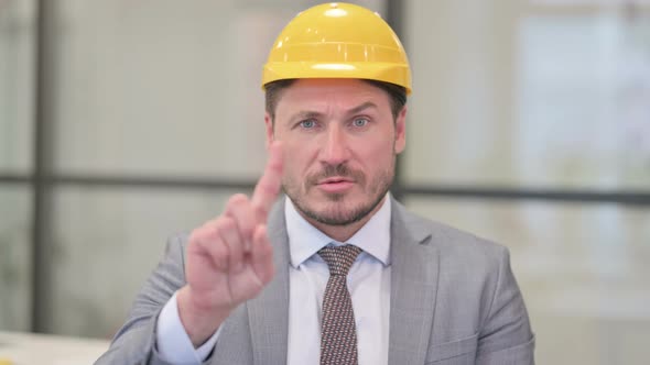 Portrait of Middle Aged Engineer Showing No Sign by Finger, Denial
