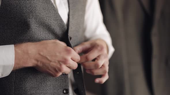 Buttoning Jacket with Hands Close Up Man in Suit Fastens Buttons on His Jacket Preparing to Go Out