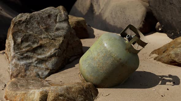 Old Cooking Gas Cylinder on Sand Beach