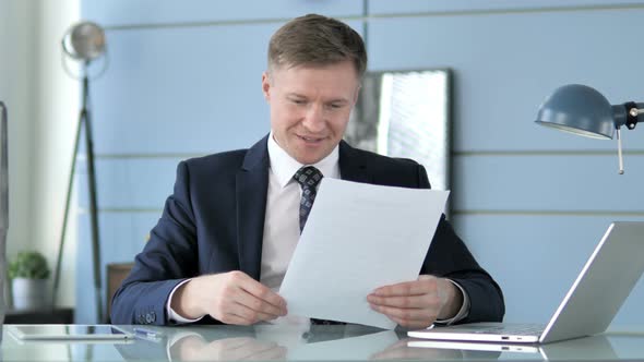 Businessman Celebrating Success of Contract