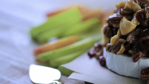 Caramel nut and cranberry brie appetizer for Christmas party.