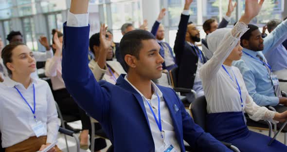 Multi ethnic business people raising hands in the business seminar 4k