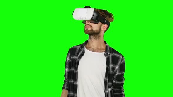 Man in Virtual Reality Glasses. Close Up. Green Screen