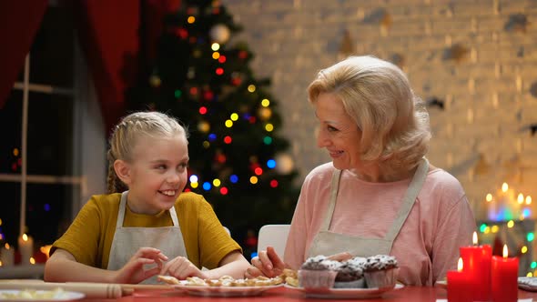 Cheerful Grandma and Girl Giving High-Five, Preparations for Holiday Finished