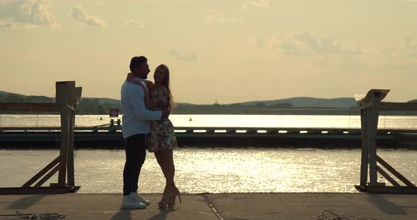 Romantic Couple Having Date on Embankment at Sunset