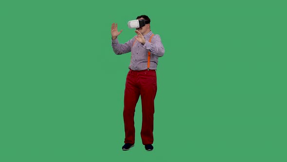 Portrait of a Dancing Man with a Virtual Reality Headset or 3d Glasses on His Head