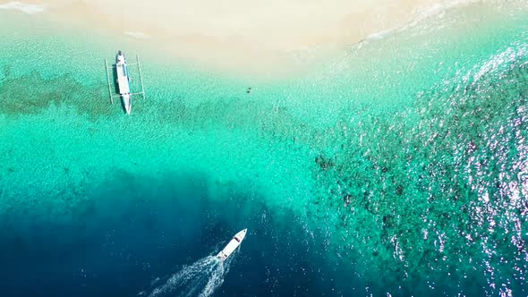 Aerial drone view scenery of relaxing coast beach holiday by clear ocean and white sandy background 