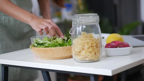 Close Up Asian woman ingredients for making a salad, vegetable, strawberry cooking a healthy.