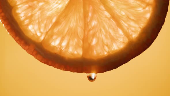 Juicy Orange Slice on Orange Background