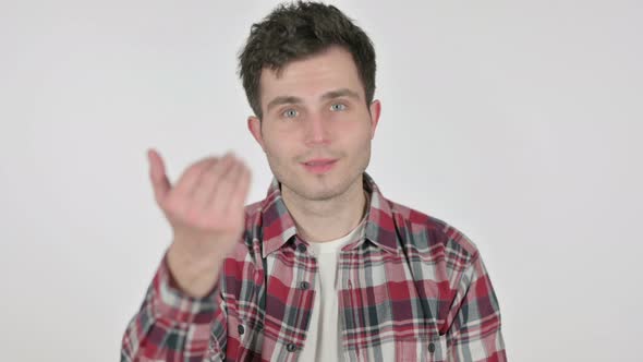 Portrait of Young Man Pointing at Camera Inviting