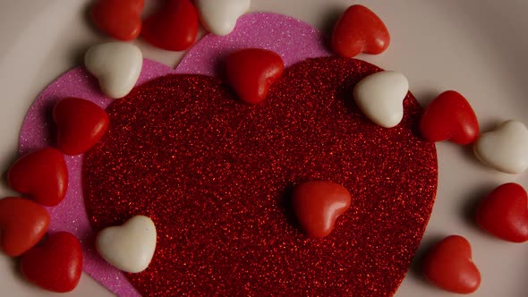 Rotating stock footage shot of Valentines decorations and candies - VALENTINES 0105
