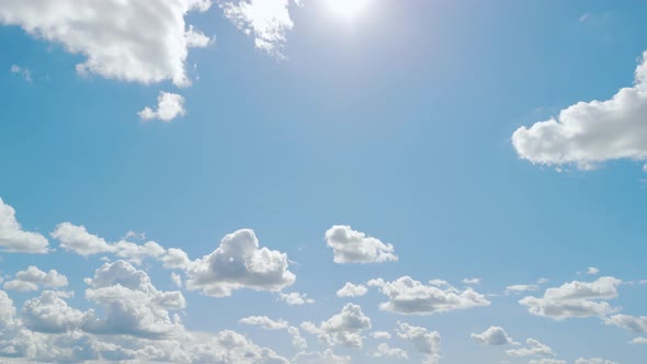 Air Plane Window View of Clouds and Blue Sunny Sky