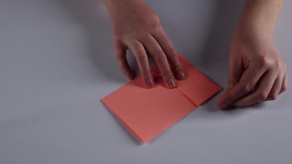 Woman Makes Paper Windowsill. White. Time Lapse