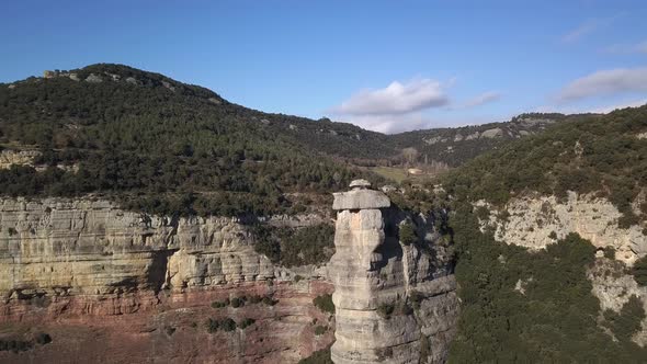 Aerial view of steep cliffs over huge precipice, arc shot