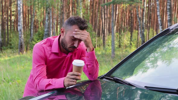 Upset Businessman Leaning on the Hood Drinking Coffee Thinking and Feeling Sad