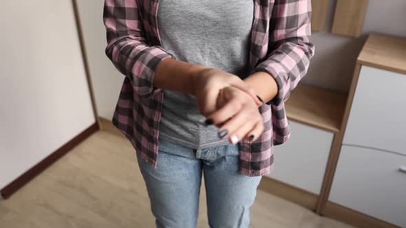 Slow motion of Female hands care, woman rubs the cream on her hands