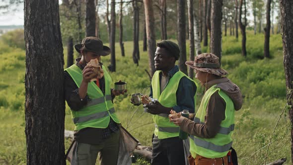 Ecologists Snacking in Woods