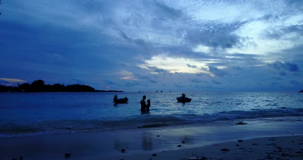 Happy couple after marriage in love enjoy life on beach on clean white sand background 