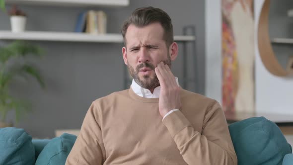 Portrait of Man Having Toothache Cavity