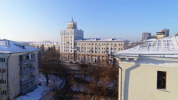 Ancient Town Hall with Tower in Street on Winter Day