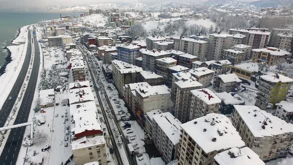 Snowy Town Houses by Sea in Winter