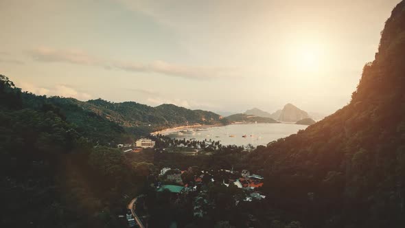 Port Town Cityscape at Sun Tropical Mountain Forest Aerial View