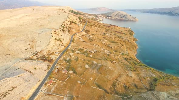 Aerial view of road through barren landscape of Pag island in Croatia