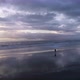 Beautiful Tranquil Natural Vacation Seascape of a Girl Running on the Wet Beach - VideoHive Item for Sale