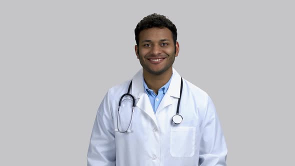 Portrait of Handsome Darkskinnend Doctor Showing Like Gesture