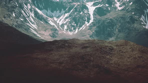 Mountain Gorge with Green Meadow Illuminated By the Sun alt