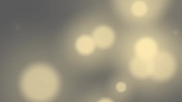 Animation of glowing spots of light moving and flickering in hypnotic motion on out of focus alt