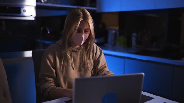 Young Female Blogger Live Streaming Via Laptop Wearing Face Mask