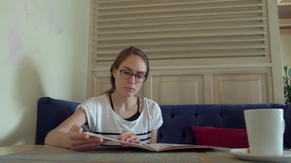 Female looking at menu in restaurant