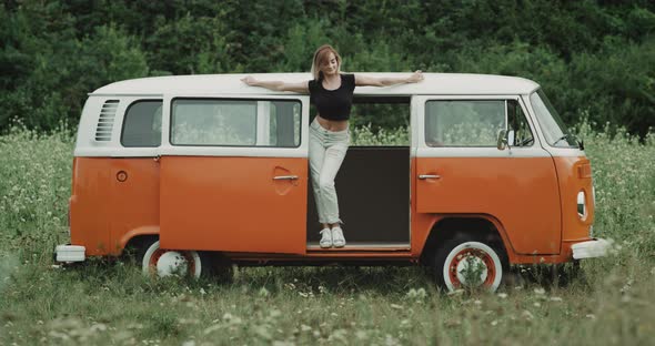 Beautiful Young Ladie Dacing in a Retro Van in the