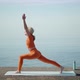 Yoga on the Street a Woman Does Asanas on the Background of the Sea - VideoHive Item for Sale