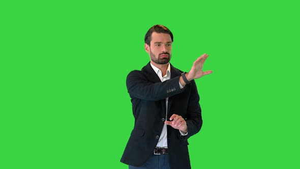 Businessman Touching on a Virtual Screen on a Green Screen Chroma Key