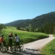 Three cyclist looking at map in landscape, Alta Badia, Italy - VideoHive Item for Sale