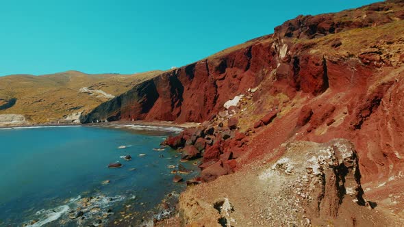 Panning Shot of Red Volcanic Coast in the Mediterranean