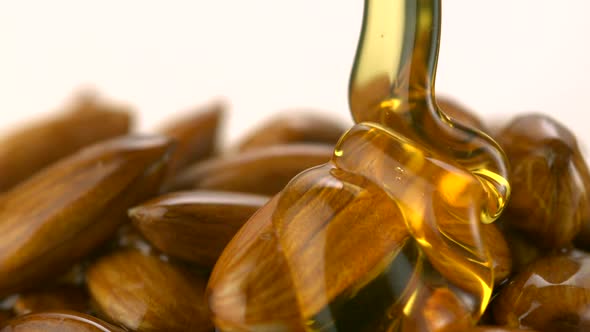 Honey pouring on almond, Slow Motion alt