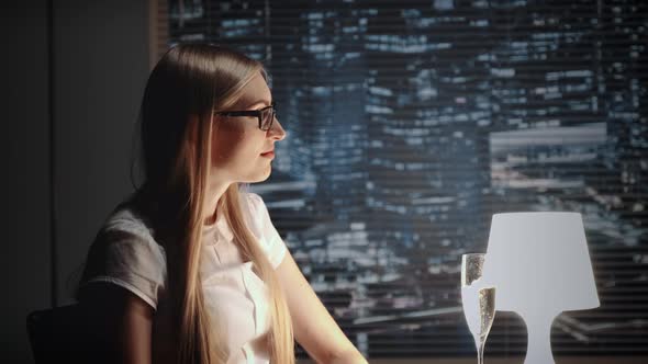 Pretty Business Lady in Eyeglasses Making Cheers with Bocal of Champagne