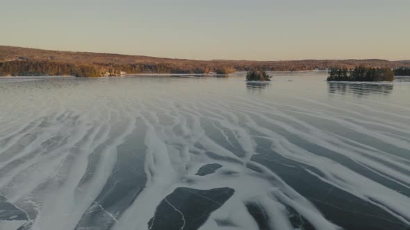 Sunset on frozen Moosehead Lake. Maine. USA. Aerial sideways