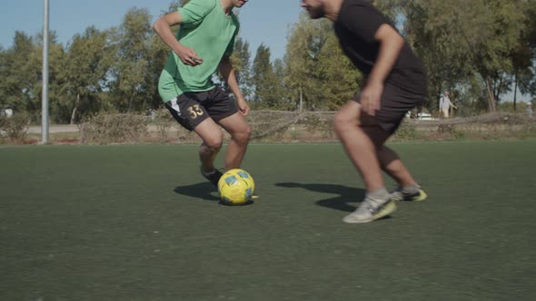 Footballer Passing Over Defenders During Dribbles