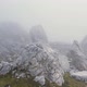 Drone flight over the foggy rocks of the Dolomites - VideoHive Item for Sale