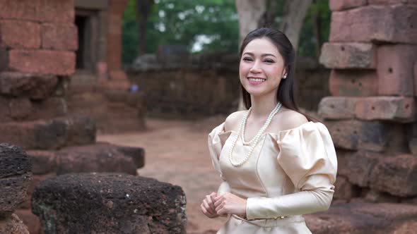 slow motion of woman in Thai traditional dress is walking