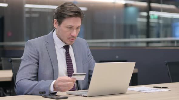 Online Payment Success on Laptop by Middle Aged Businessman