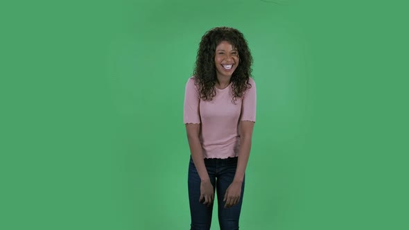 Portrait of Beautiful African American Young Woman Is Looking at Camera and Embarrassed. Burning