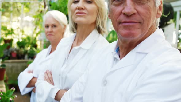 Portrait of scientists standing with arms crossed