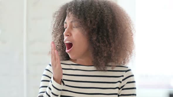 Exhausted African Woman Yawning