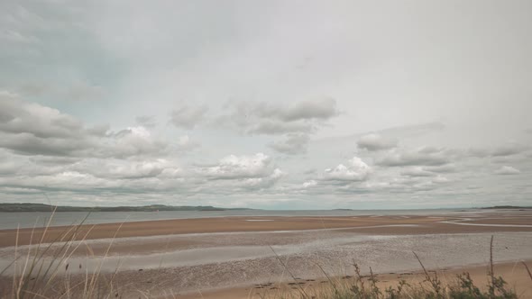 Time-lapse of fast moving clouds over the Firth or Forth Sea inlet near Edinburgh in Scotland.